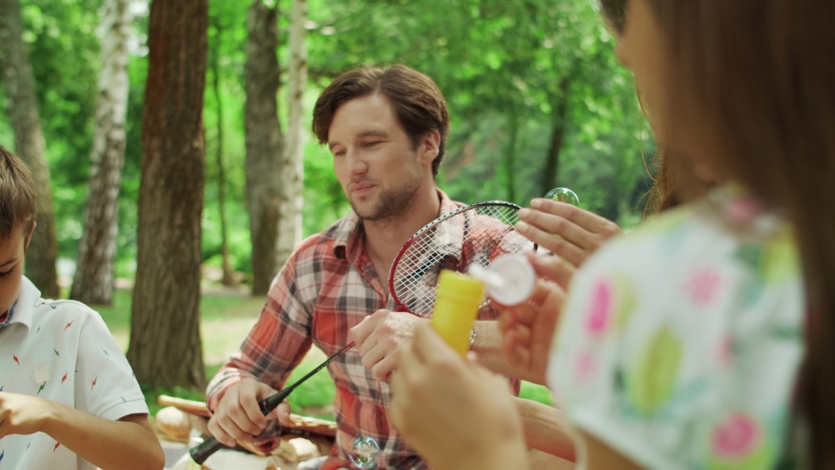 family-having-fun-park-together-happy-siblings-playing-with-soap-bubbles.jpg